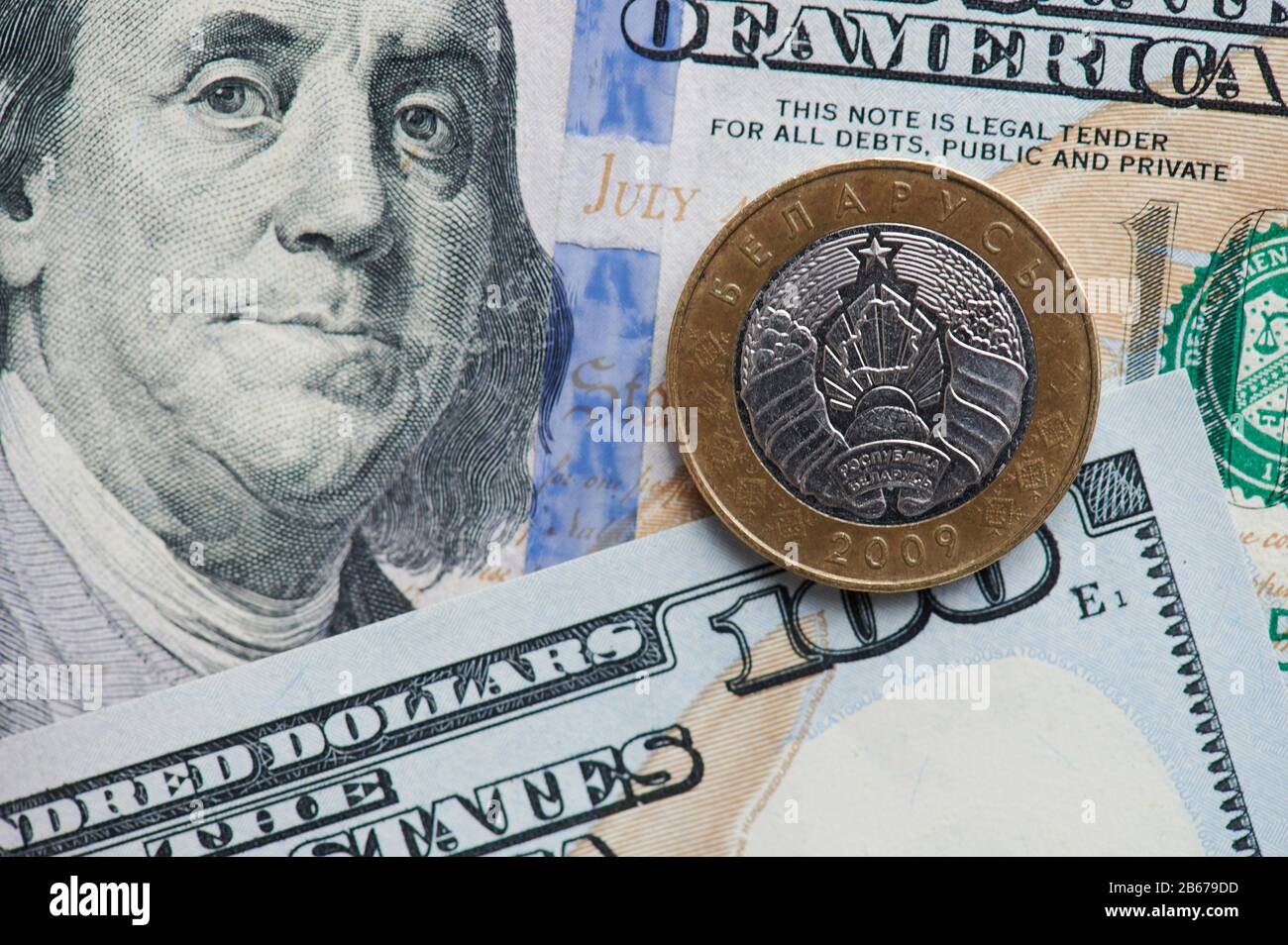 Two  Belarusian rubles coin on dollar background close up view Stock Photo