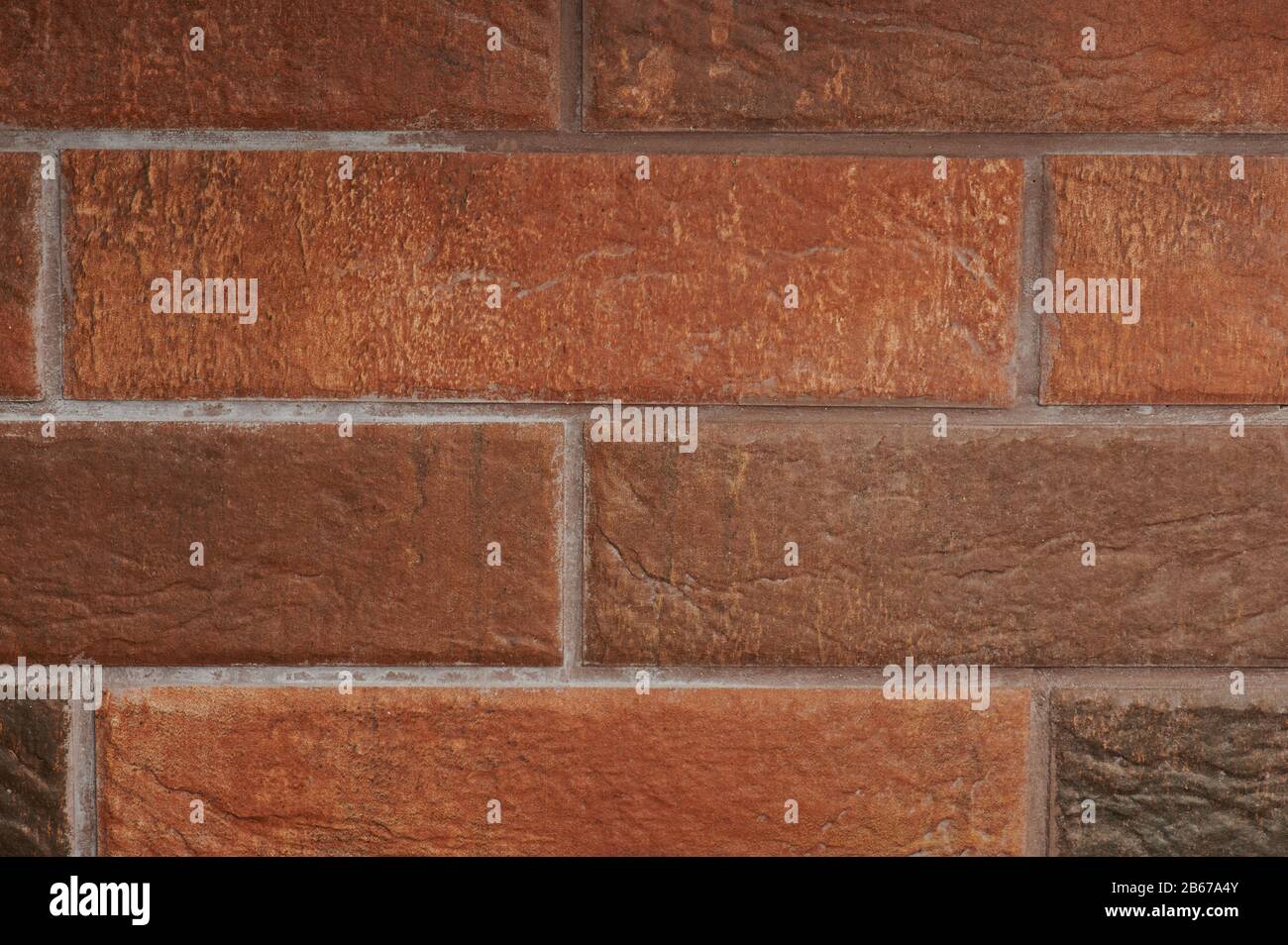 Red brick wall background close up view. Red block tiles Stock Photo