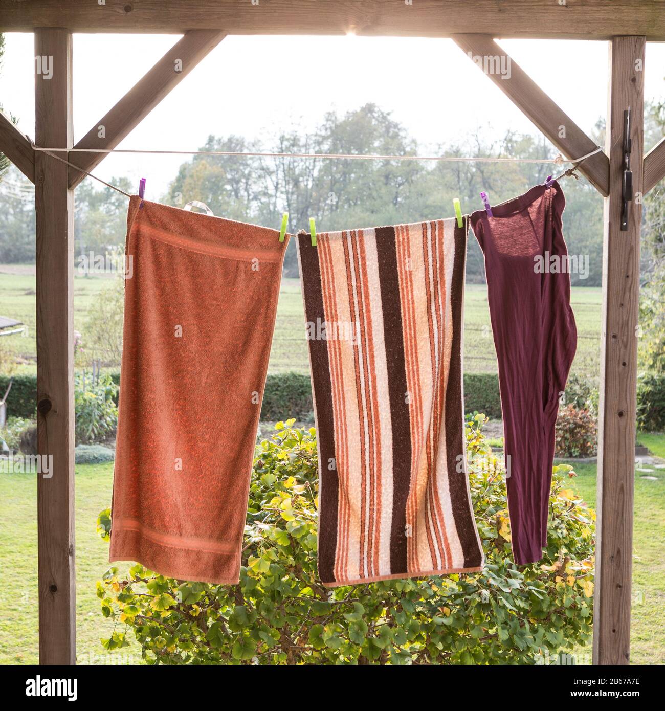 linen towels weighs outside and dry on a rope Stock Photo Alamy