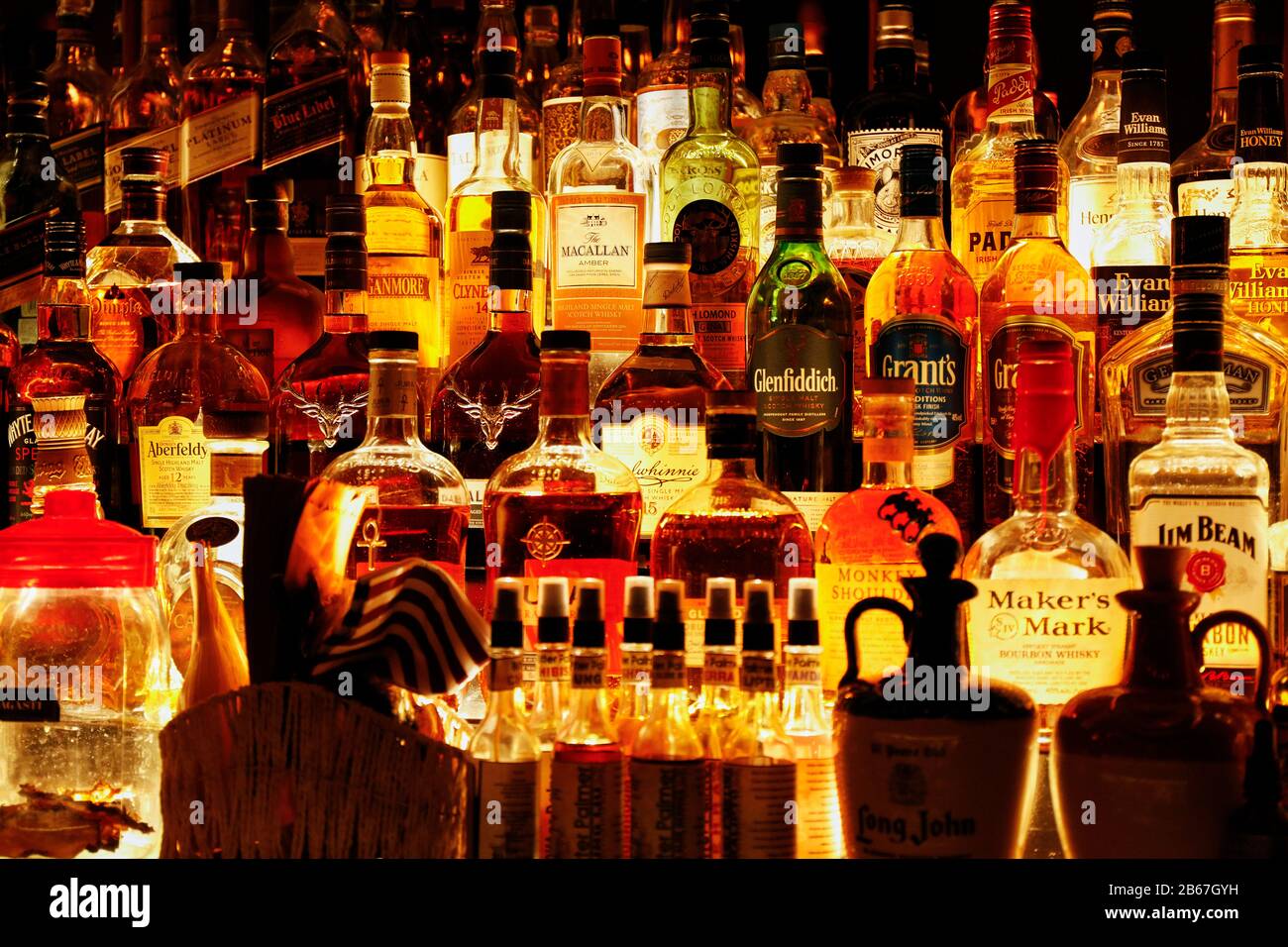 Bottles of spirits inside a cocktail bar. Stock Photo