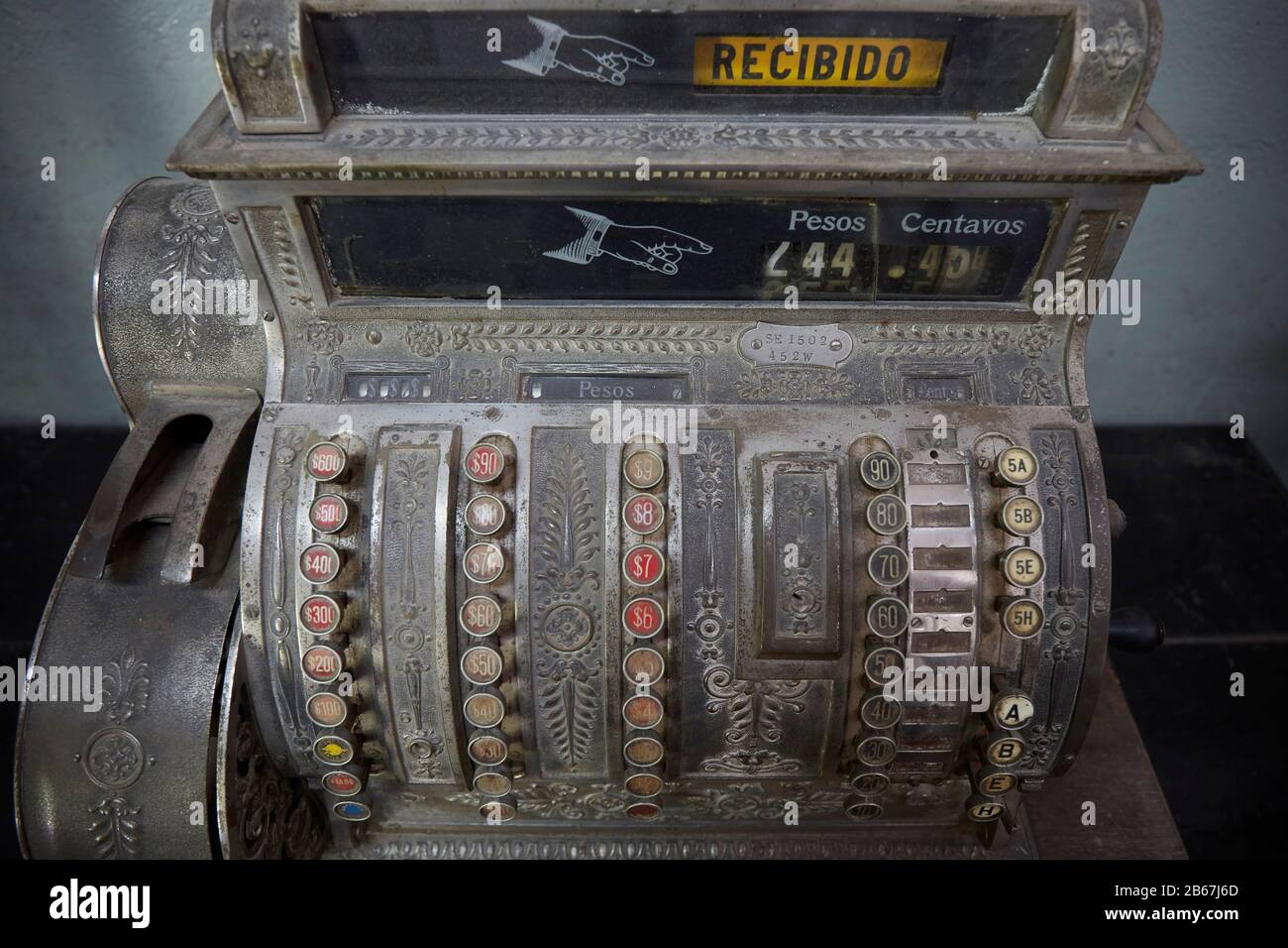 Old cash box machine in pesos, Argentina. Stock Photo