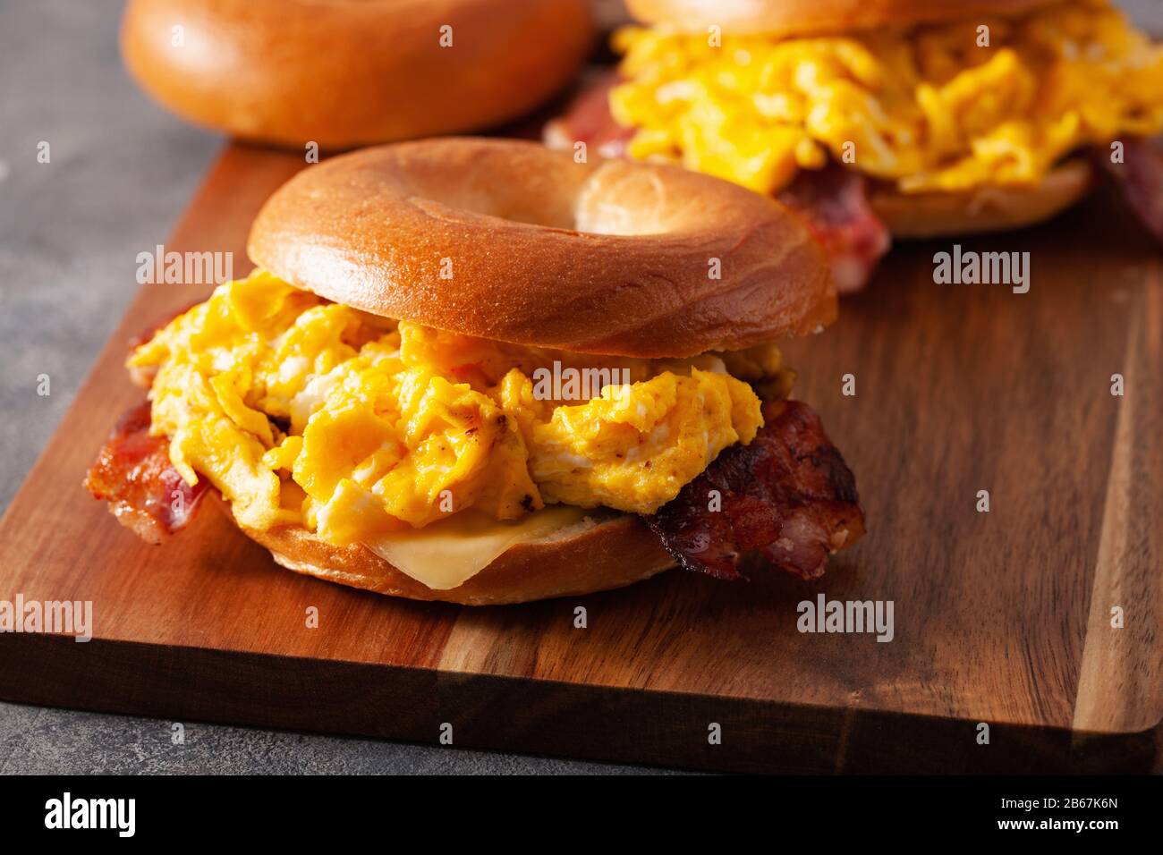 breakfast egg and bacon sandwich on bagel with cheese Stock Photo - Alamy