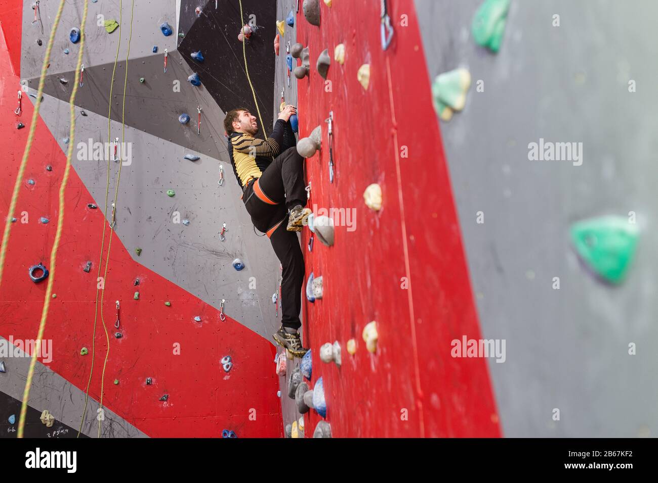 Man climbing indoor wall hi-res stock photography and images - Alamy