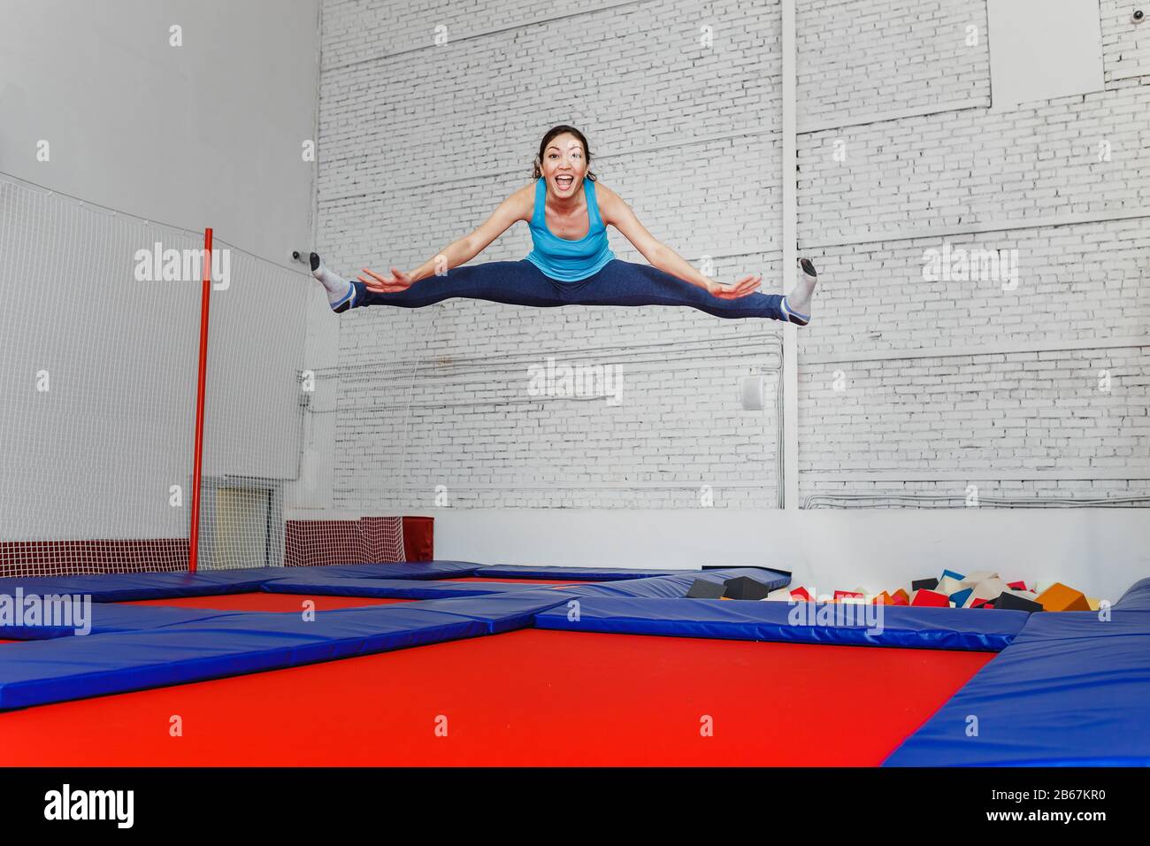 Teenage girl jumping on trampoline hires stock photography and images