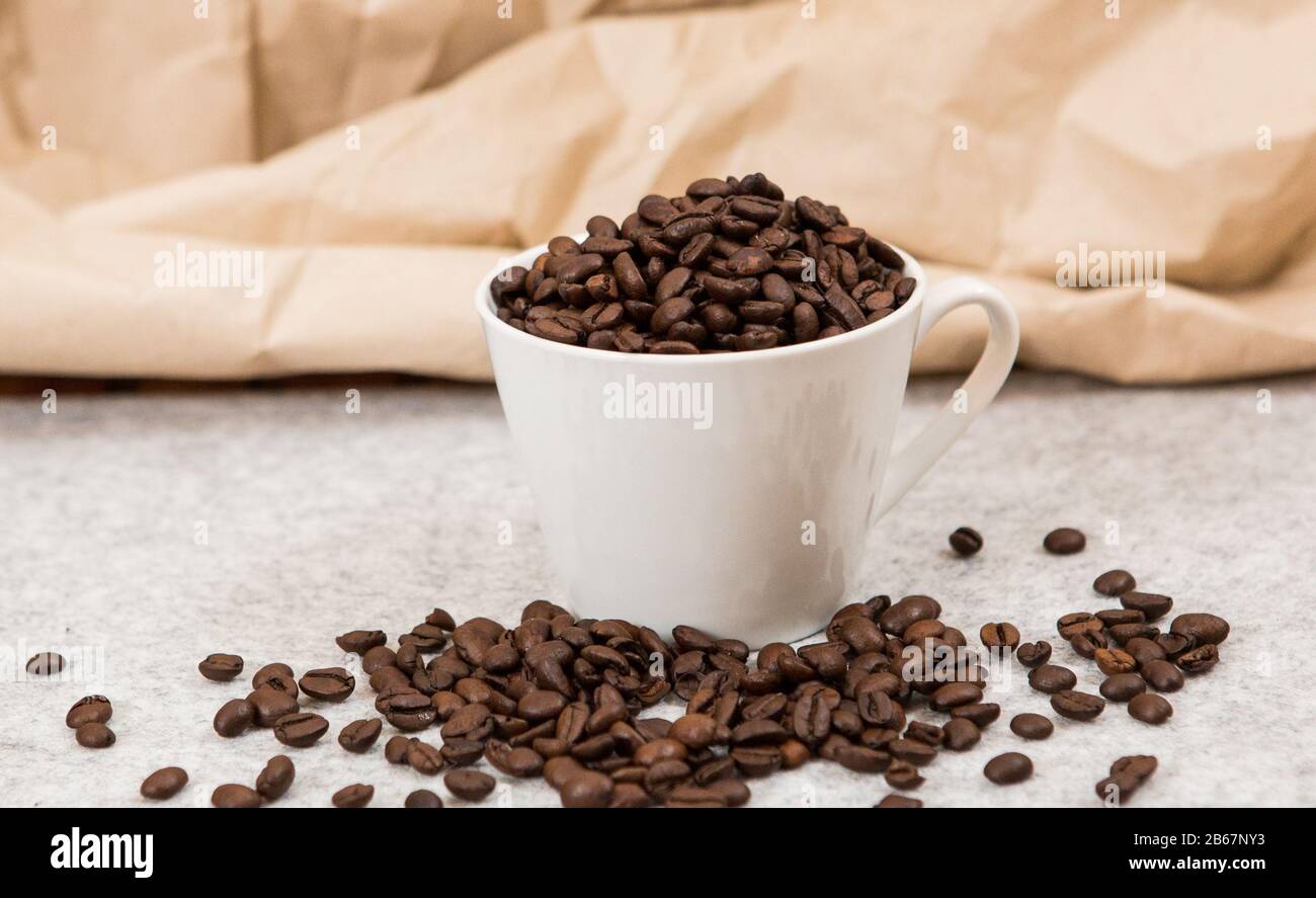 Good coffee beans in a caffe mug Stock Photo Alamy