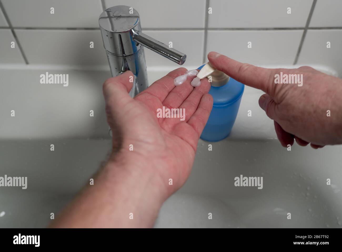 Domestic hygiene, washing hands with soap and water Stock Photo - Alamy