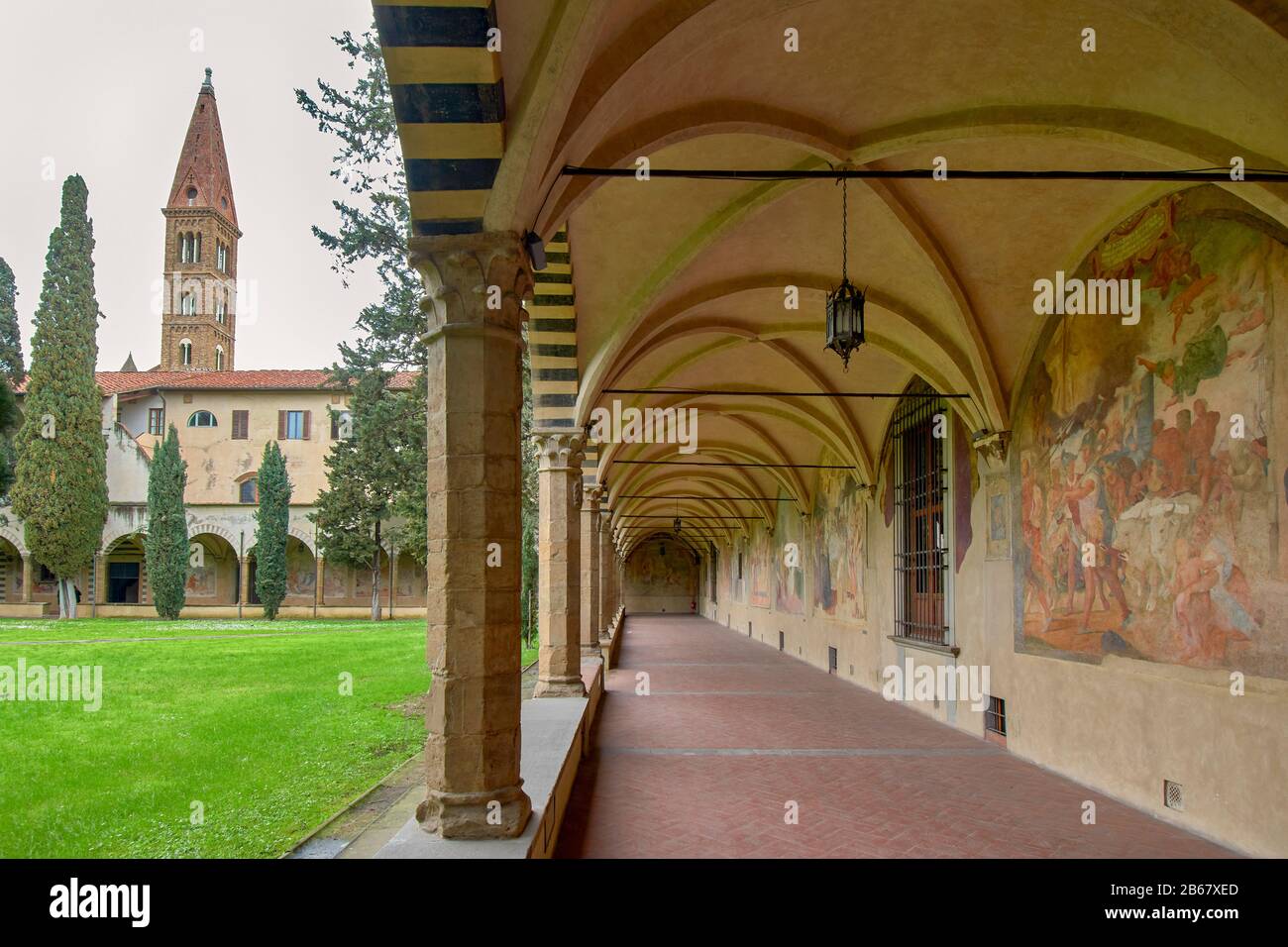 FLORENCE ITALY CHURCH SANTA MARIA NOVELLA VIEW OF THE EXTENSIVE GRAND CLOISTERS AND FRESCOES OR PAINTINGS Stock Photo
