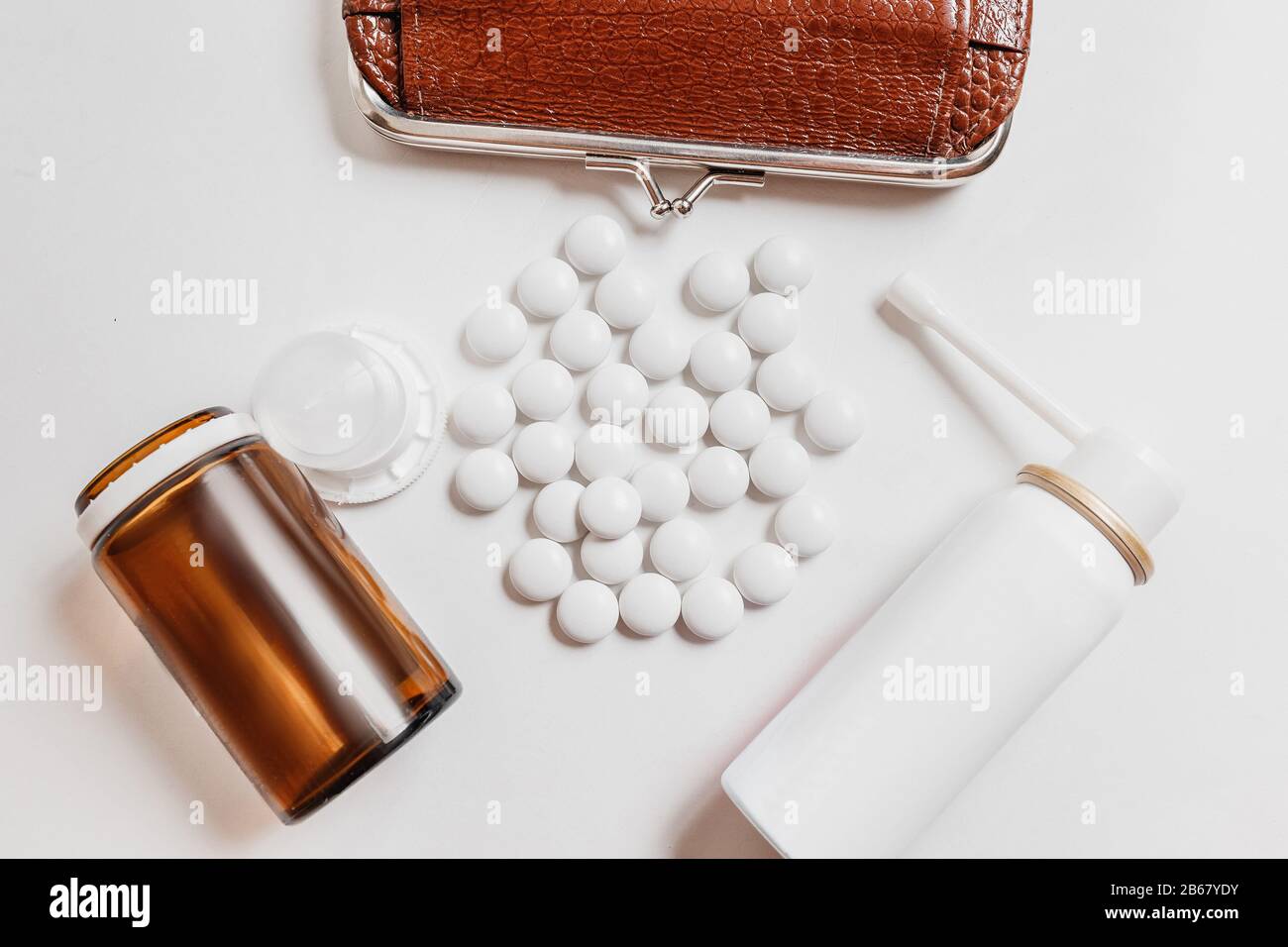 Medicine drugs and pills and a purse on white Stock Photo Alamy