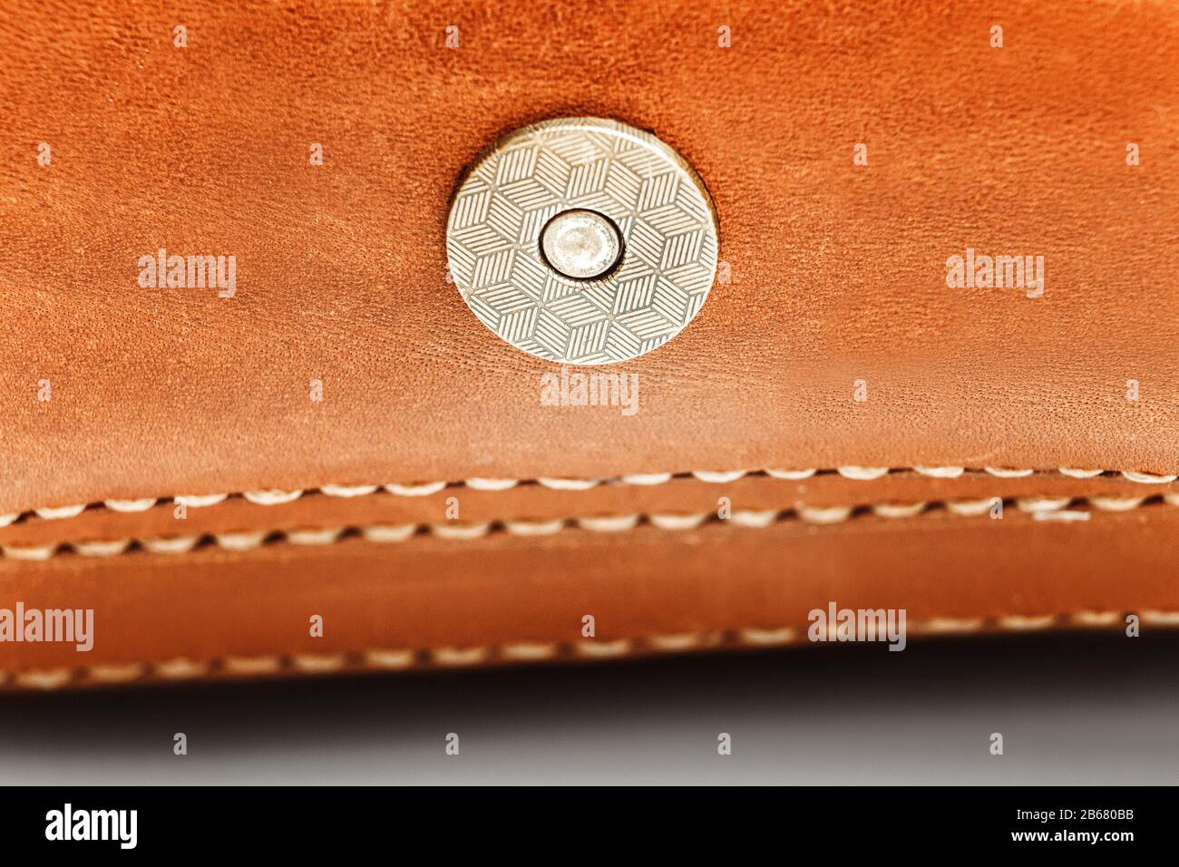 Cloesup of a leather handbag with a belt buckle Stock Photo