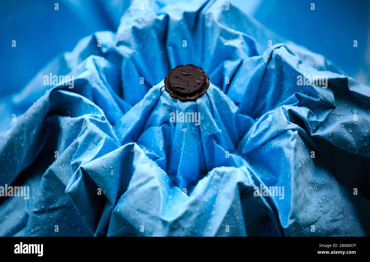 Rain drops on a blue umbrella , Raindrops on an umbrella Stock Photo