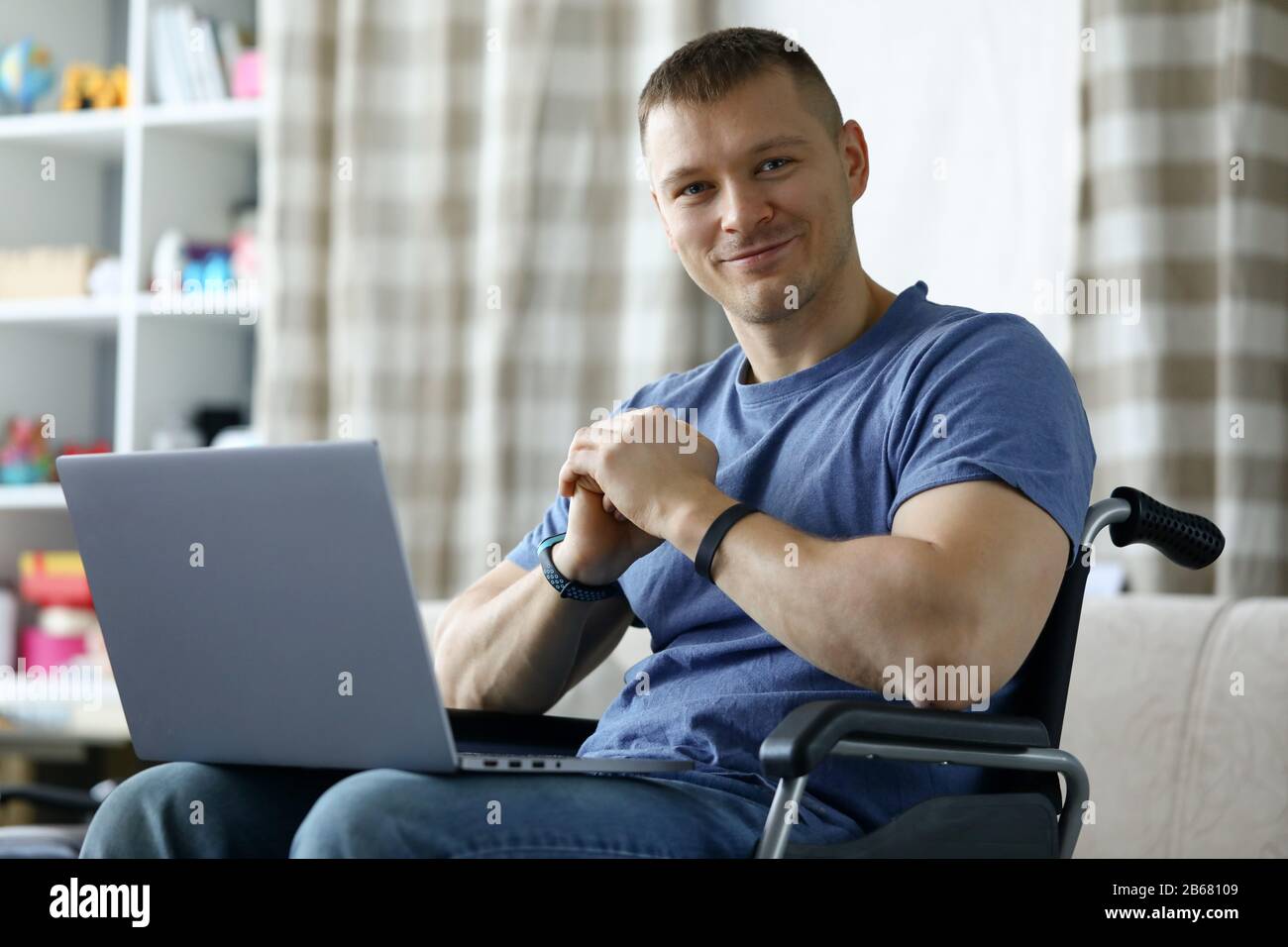 Cheerful man using computer Stock Photo - Alamy