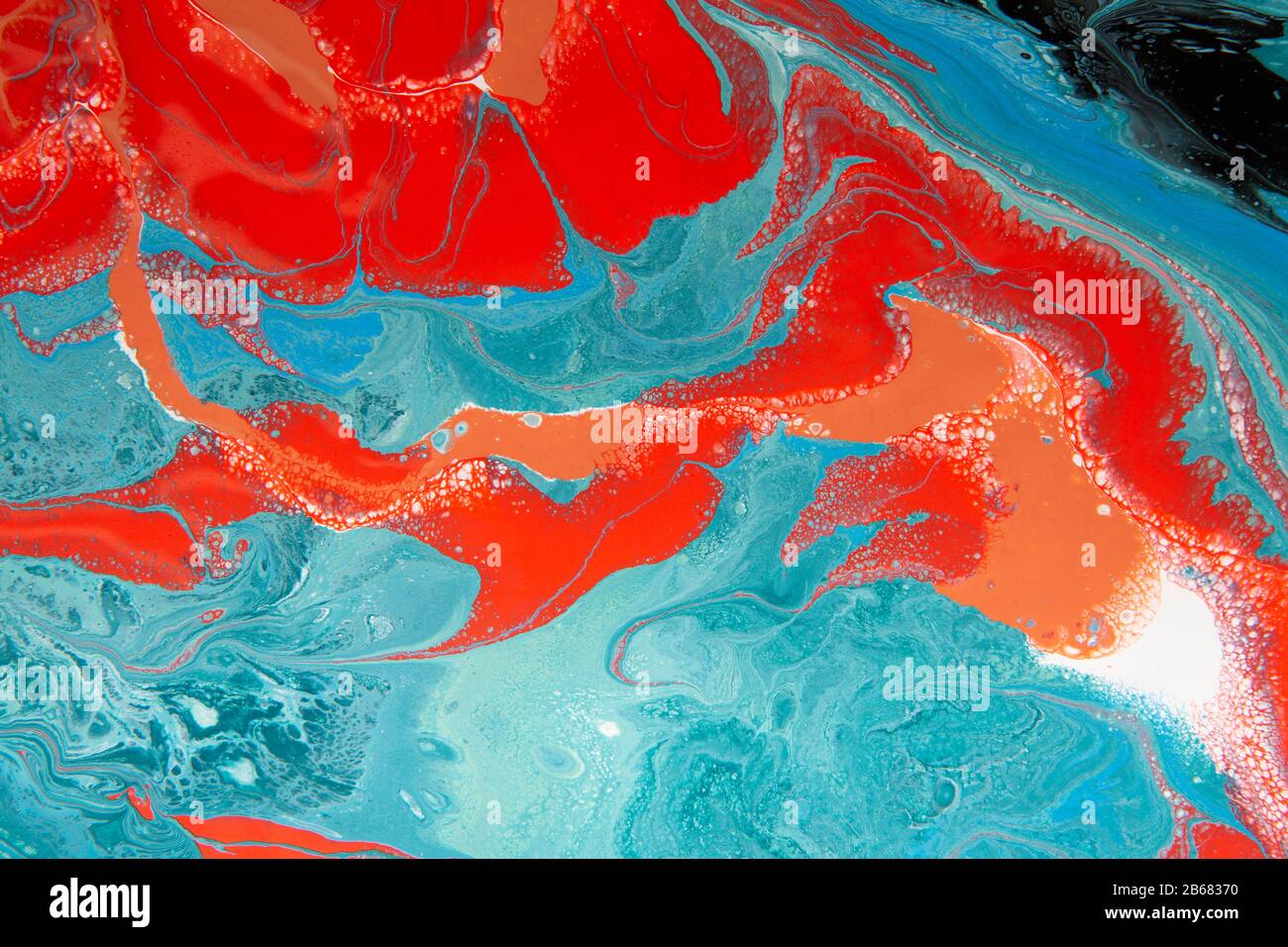 Red, blue and black pattern, swirl of acrylic color splashing Stock
