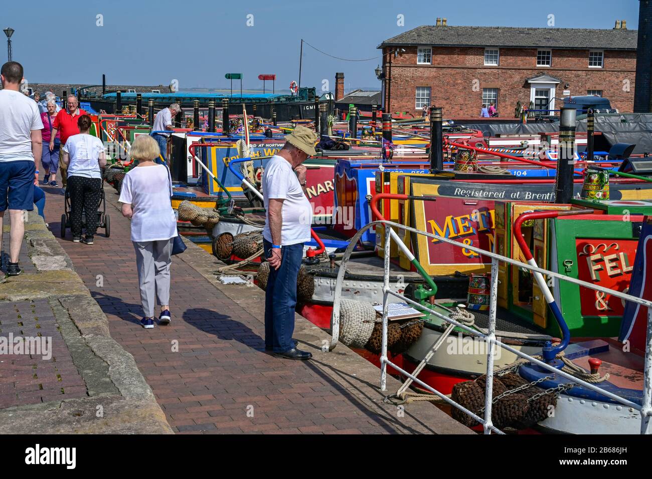 People look at canal boats from around the country at the National Waterways Museum, Ellesmere Port during the annual Easter Boat Gathering. Stock Photo