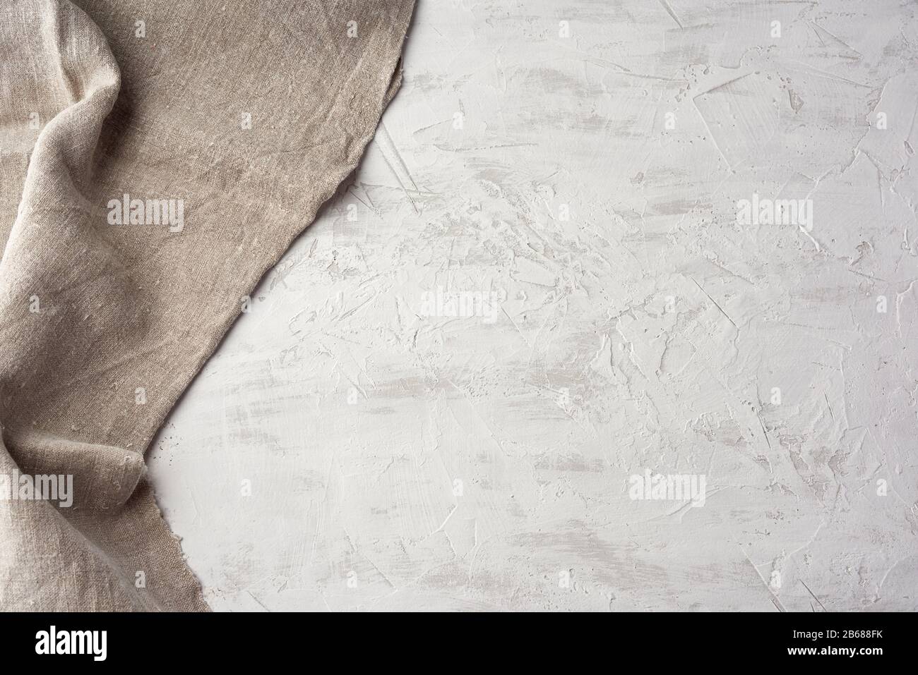 https://c8.alamy.com/comp/2B688FK/old-gray-vintage-kitchen-towel-on-white-cement-background-top-view-copy-space-2B688FK.jpg