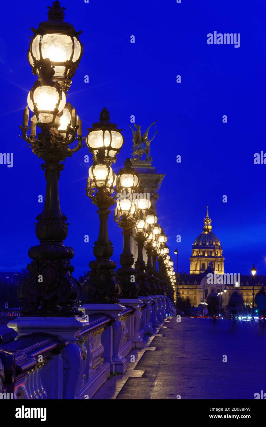 The bonze lamps on famous Alexander III Bridge in evening, Paris. Stock Photo