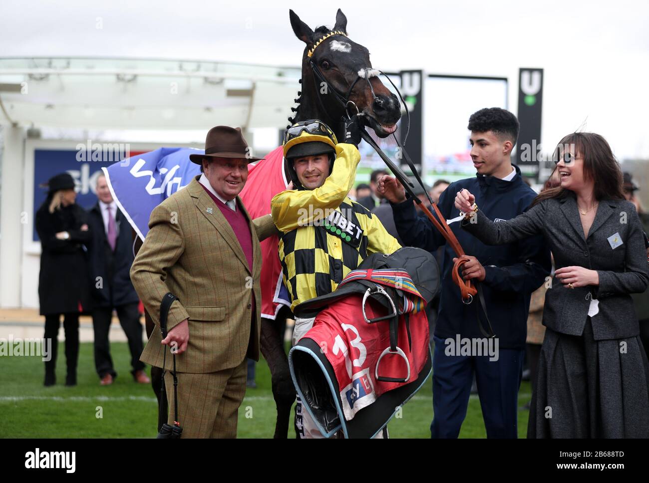 Nico de Boinville and trainer Nicky Henderson celebrate following victory in the the Sky Bet Supreme Novices' Hurdle aboard Shishkin on day one of the Cheltenham Festival at Cheltenham Racecourse, Cheltenham. Stock Photo