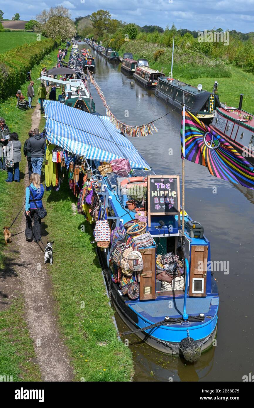 Looking down from a bridge onto a number of narrowboat traders moored near to Norbury in Staffordshire UK on a sunny summers afternoon. Stock Photo