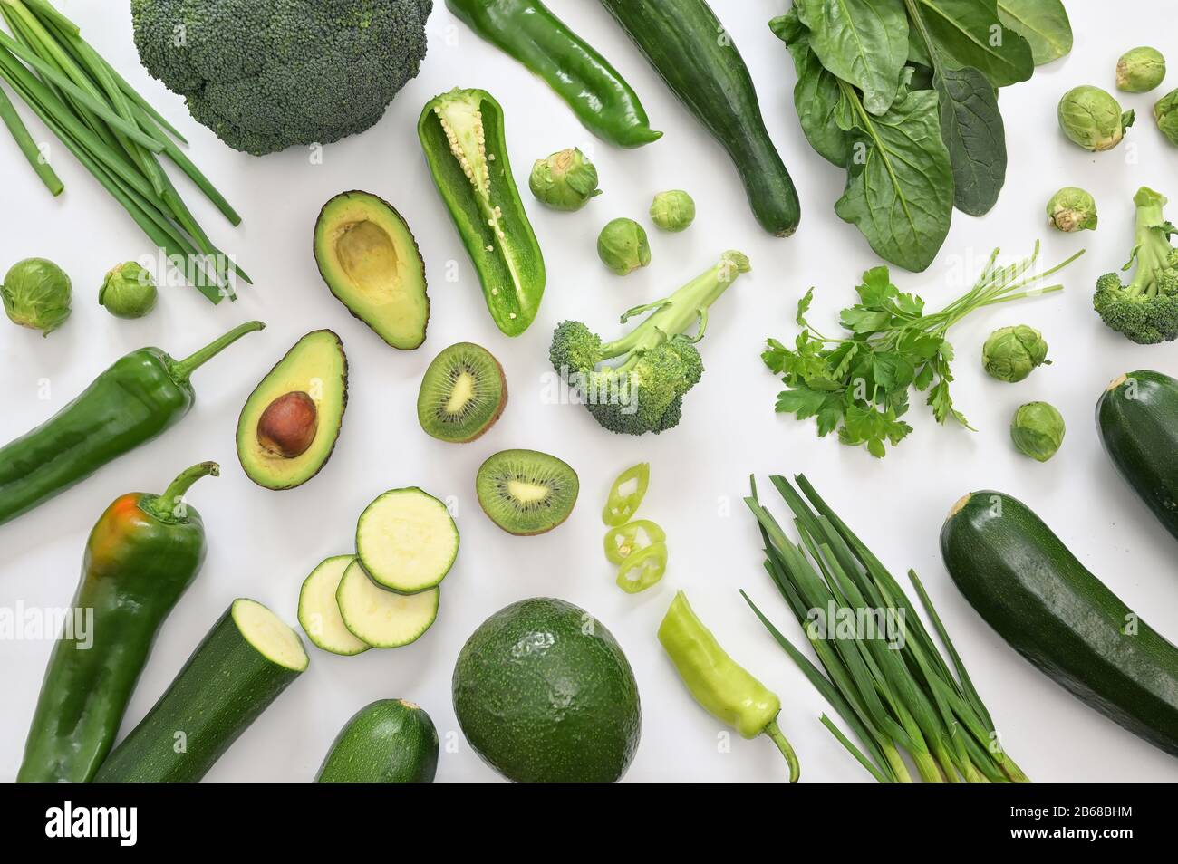 Group Of Green Vegetables And Fruits On White Background Stock Photo