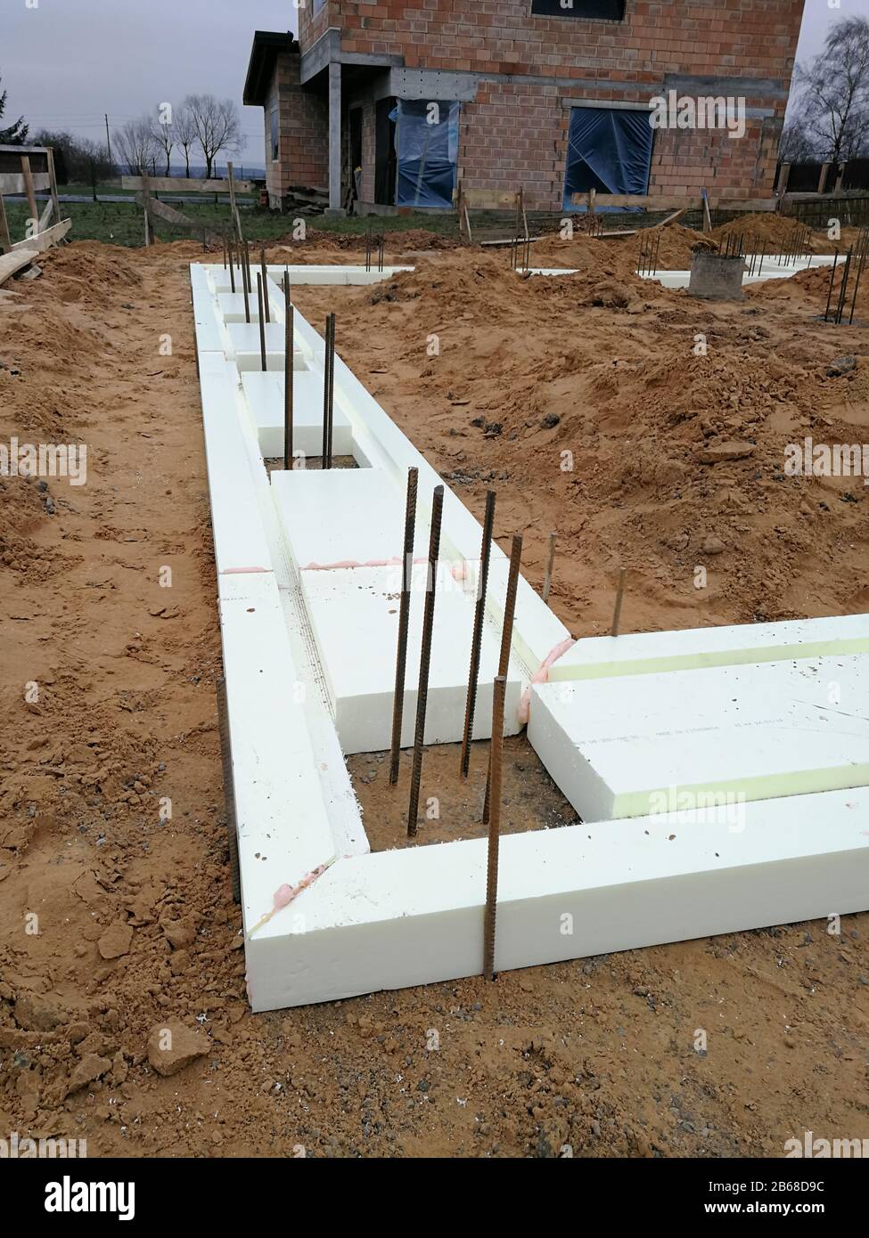 Foamboard for house foundation grate at construction site Stock Photo