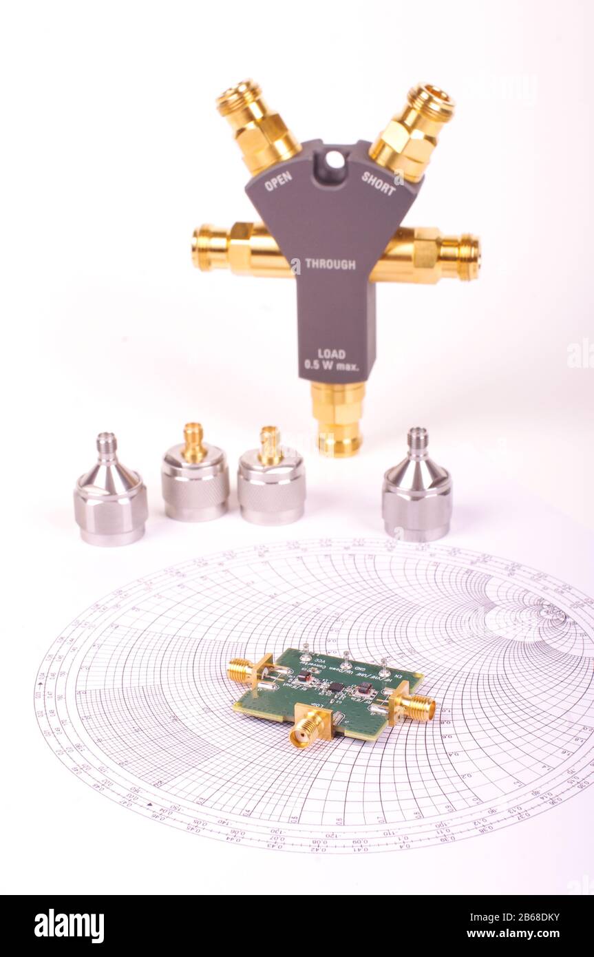 Radio frequency mixer printed circuit board in front of Smith chart and