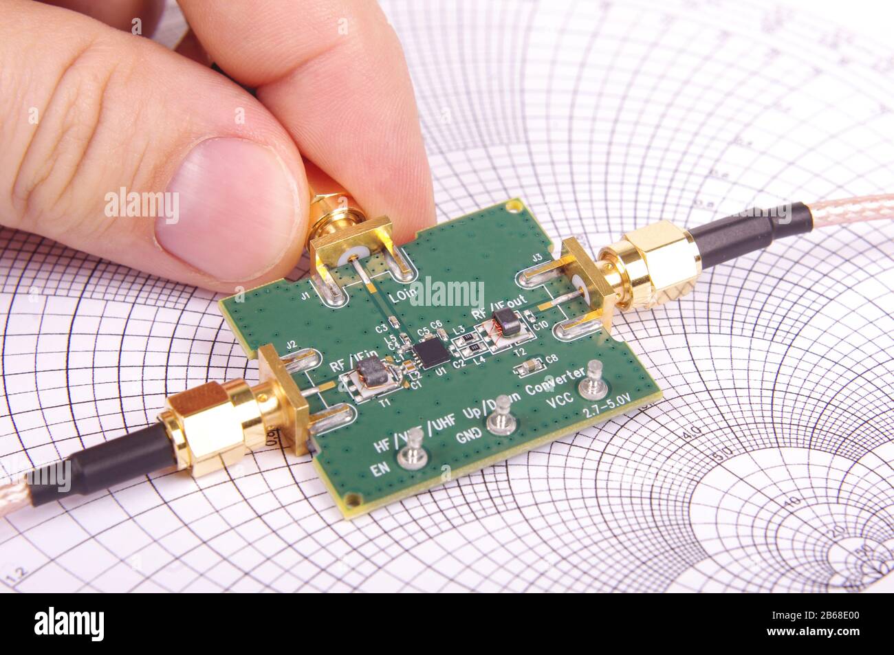 Radio frequency engineer inspect microwave mixer printed circuit board