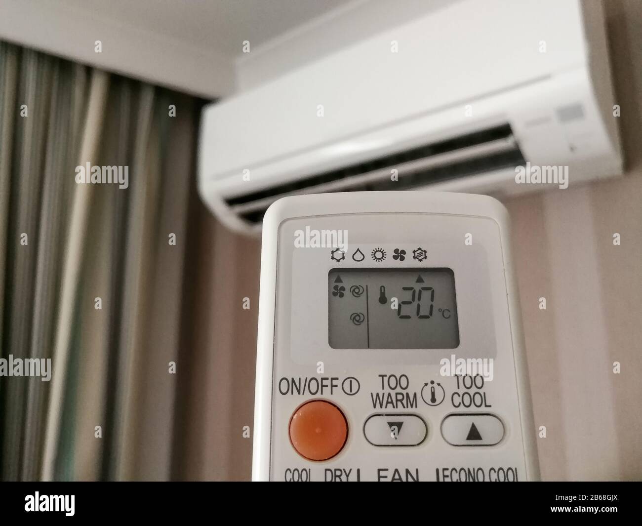 Remote control setting temperature for air conditioner on the wall Stock  Photo - Alamy