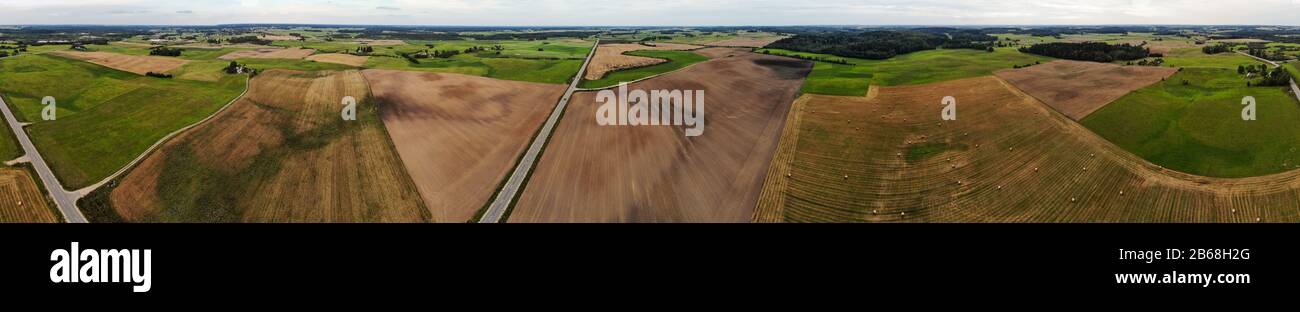 Aerial panoramic photography of late summer - autumn lithuanian farm landscape near Kraziai town Stock Photo