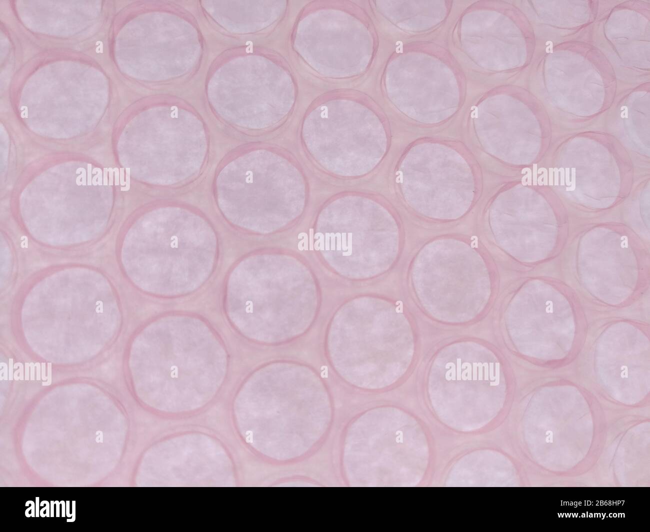 Pink bubble wrap close up for packing fragile things Stock Photo - Alamy