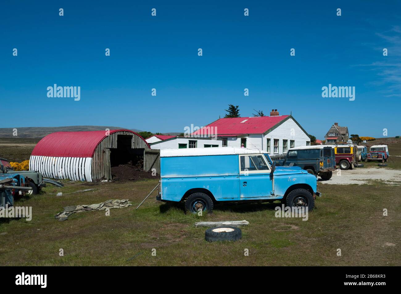 Land Rover cars in a settlement near Cape Dolphin, Falkland Islands
