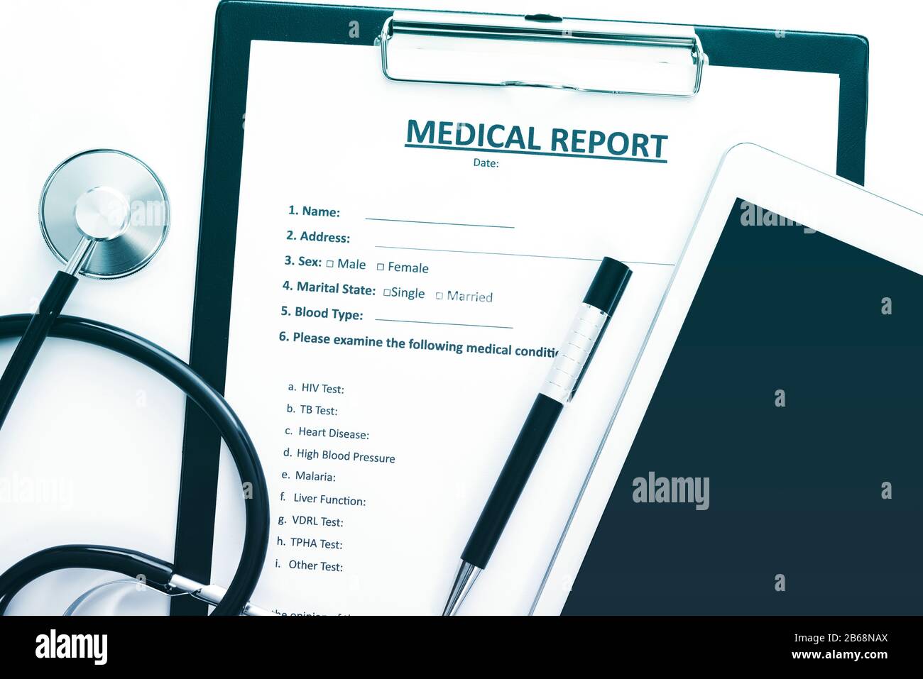 Patient modern treatment concept - medical report documents with tablet, pen and stethoscope Stock Photo