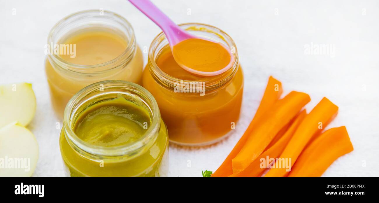 Baby food. Mashed vegetables and fruits in jars. Selective focus ...