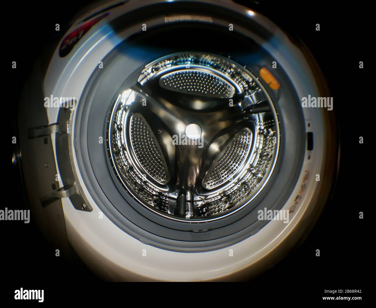 Washing machine drum with many holes internal view Stock Photo Alamy