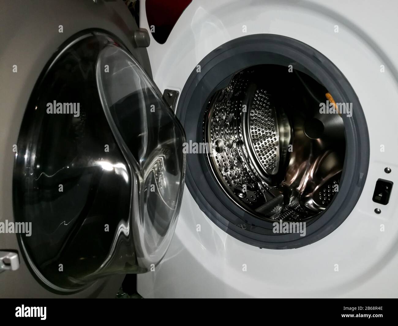 Washing machine drum with many holes internal view Stock Photo Alamy