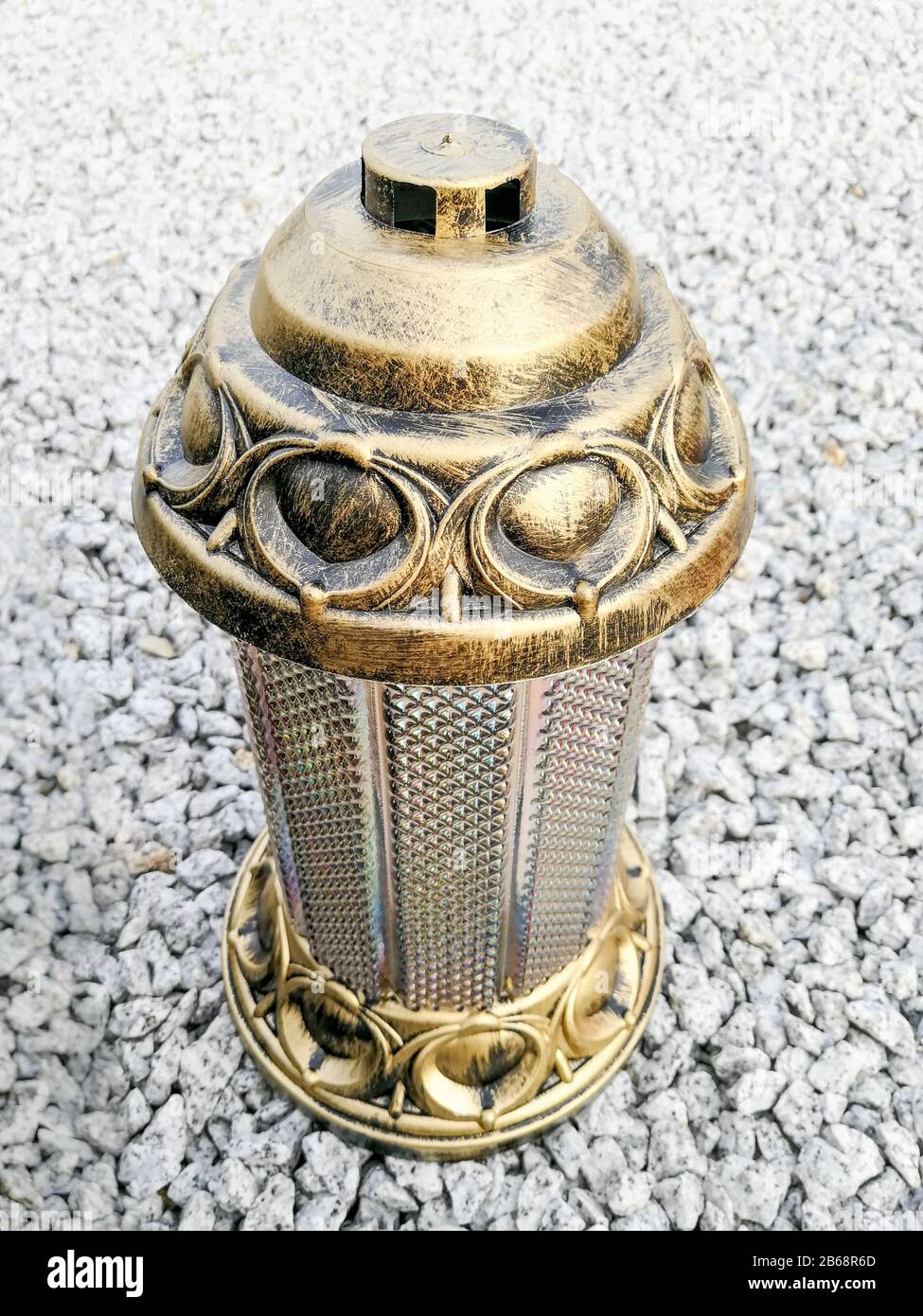 Decorated cemetery lantern candles placed on the breakstone graveyard