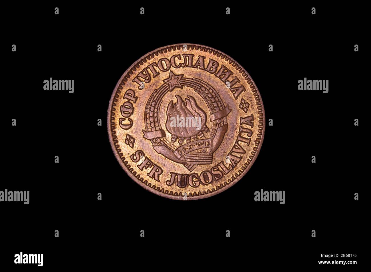 Historical numismatics coin 1943 dinar from Yugoslavia with coat of arms isolated on the black background Stock Photo