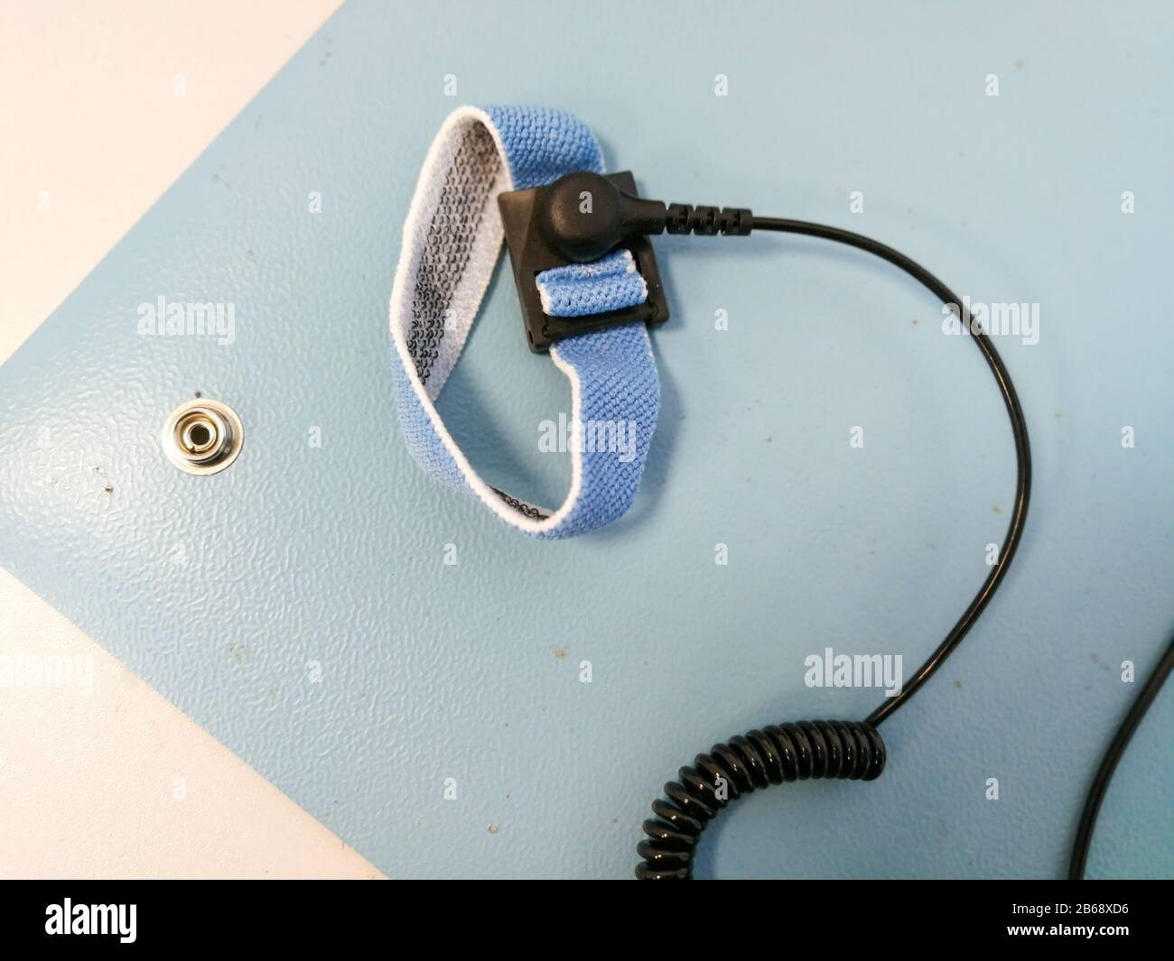 Electrostatic Discharge ESD bracelet on ESD mat. Protection against static electricity that damage electronics Stock Photo