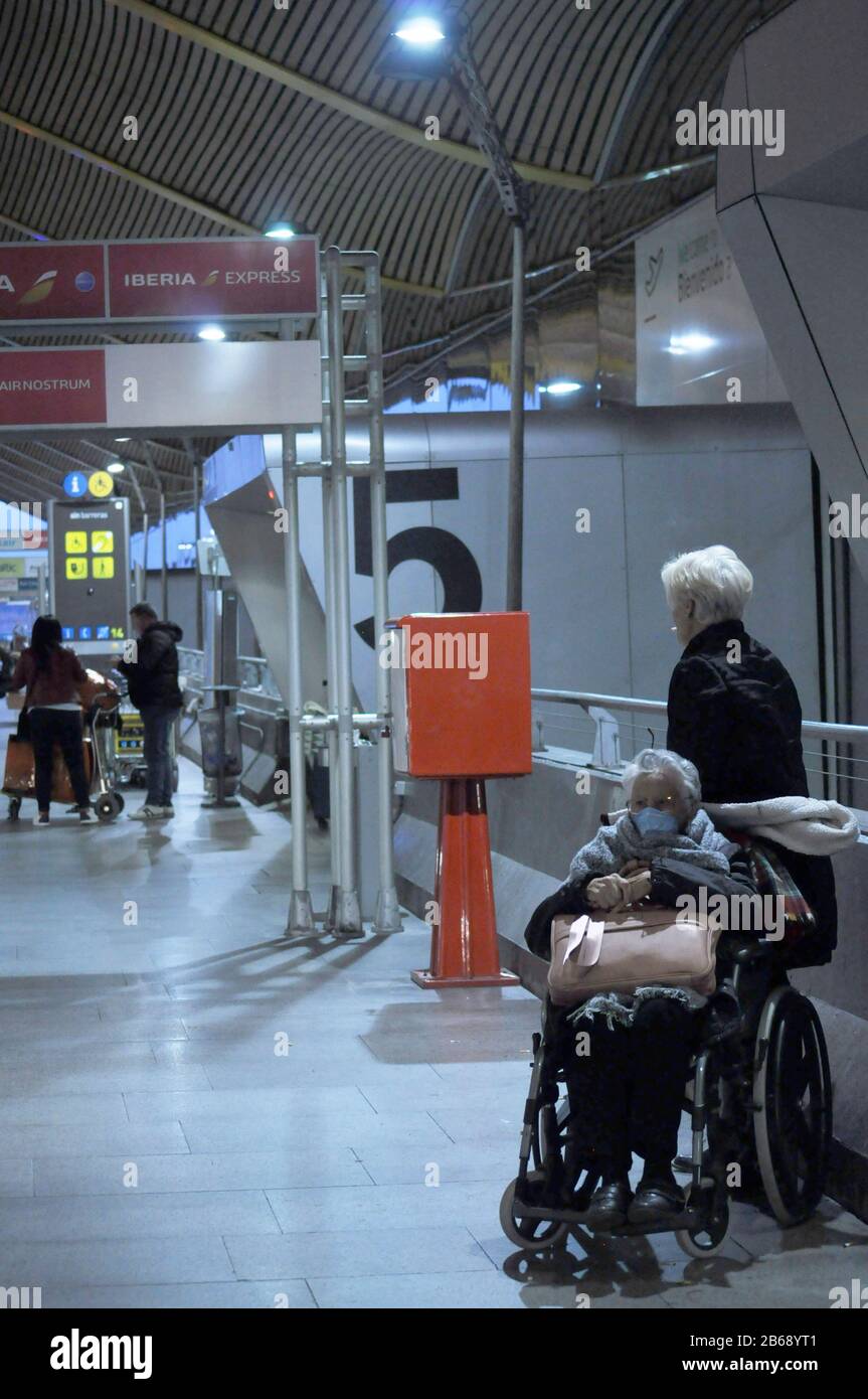 March 10, 2020 at the Madrid Barajas International Airport at 7:30 AM. Cares and precautions taken with the elderly people by the coronavirus Stock Photo