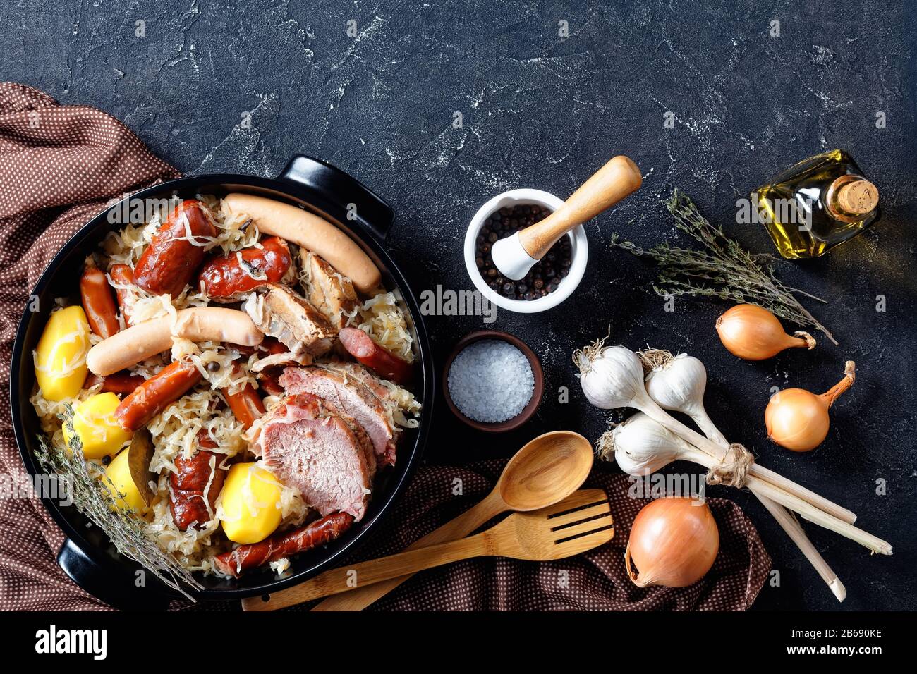 Choucroute garnie traditional french cuisine dish of sauer cabbage with smoked bacon, pork loin, sausages stewed in white wine with onion and garlic o Stock Photo
