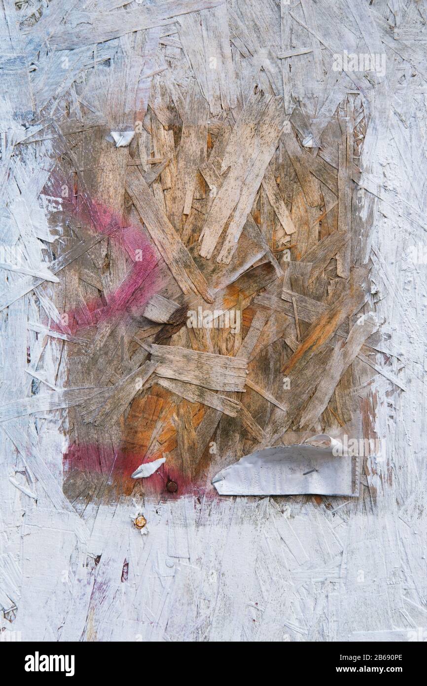 Painted white particle board with exposed square in center Stock Photo