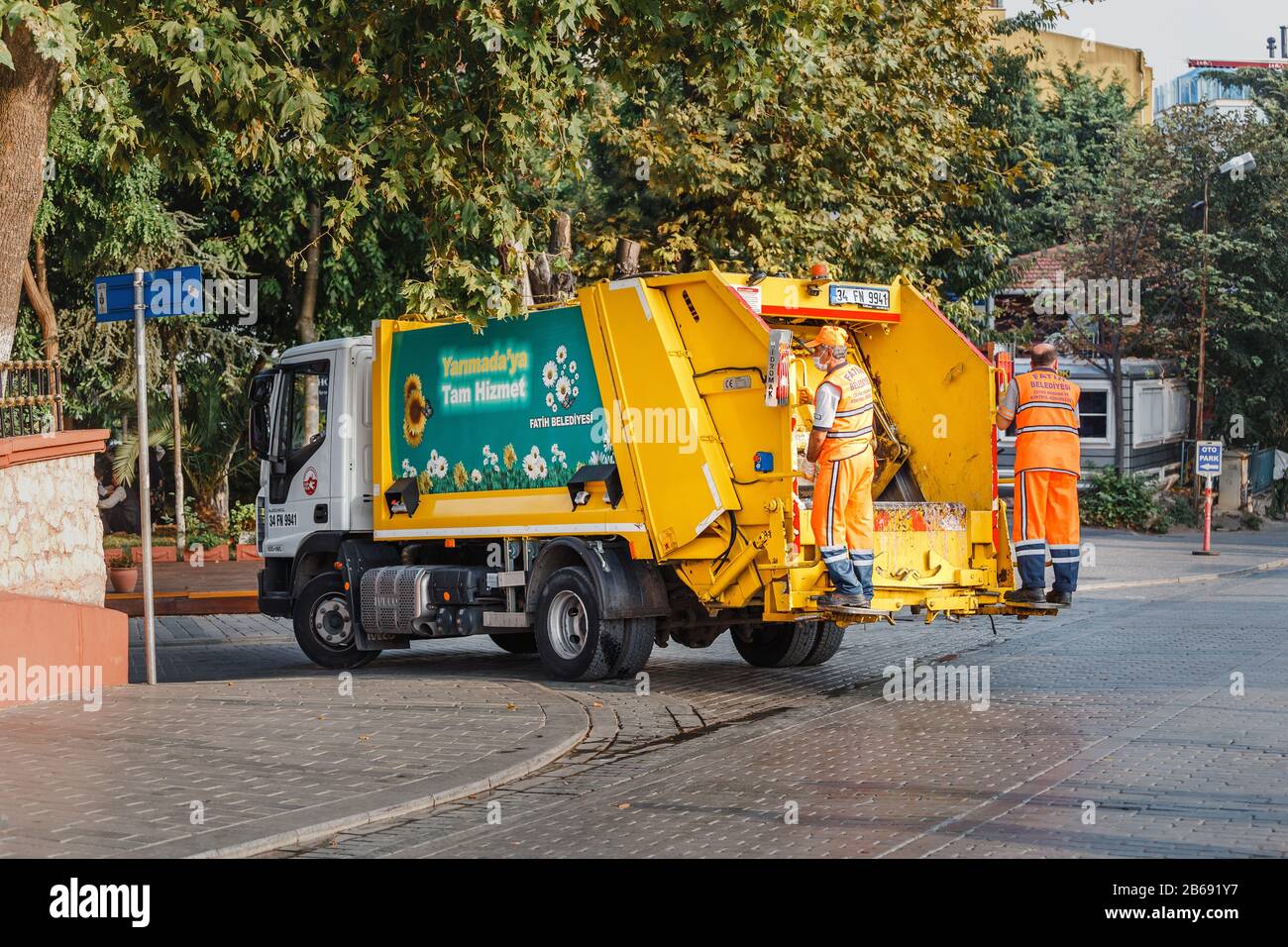 ISTANBUL, TURKEY - SEPTEMBER 10, 2017: Orange garbage truck on the central streets of Sultan ahmet Stock Photo