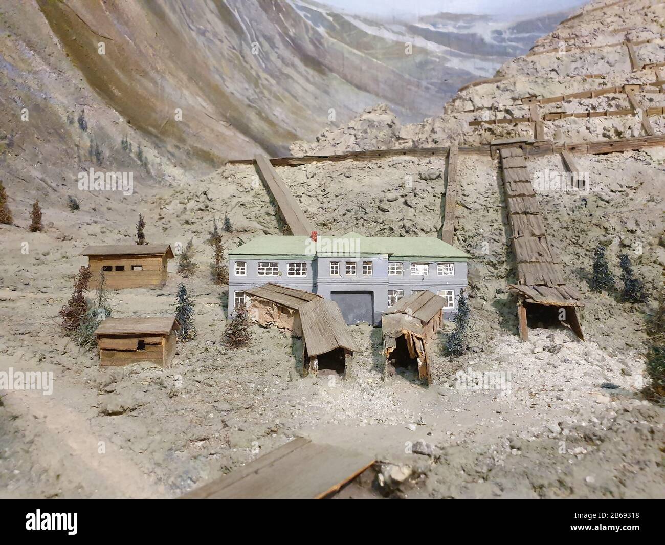 Model of a mining building in the mountains. An exact replica of the beginning of the production of rocks. Stock Photo