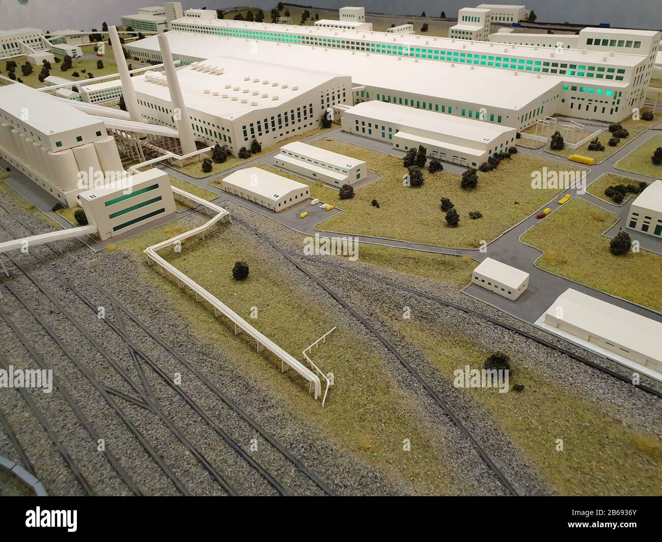 A model of a large factory or industrial complex. The copy is made of plastic and is very similar to the original buildings. Stock Photo