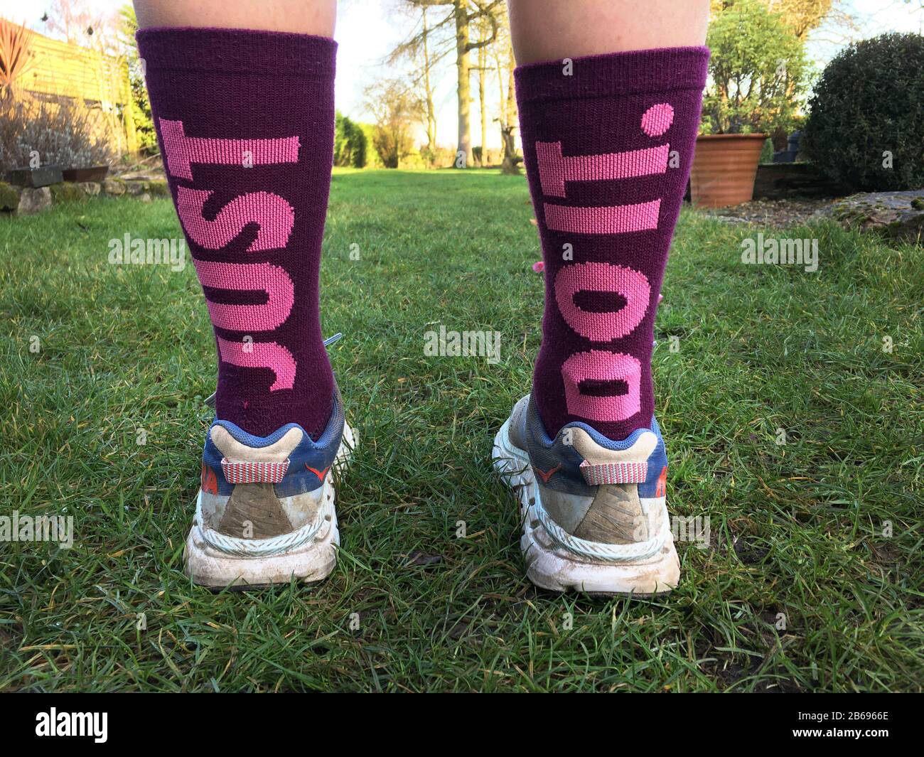 A teenage girls prepares to start a run in the countryside wearing Nikes 'Just  do it' socks, UK Stock Photo - Alamy