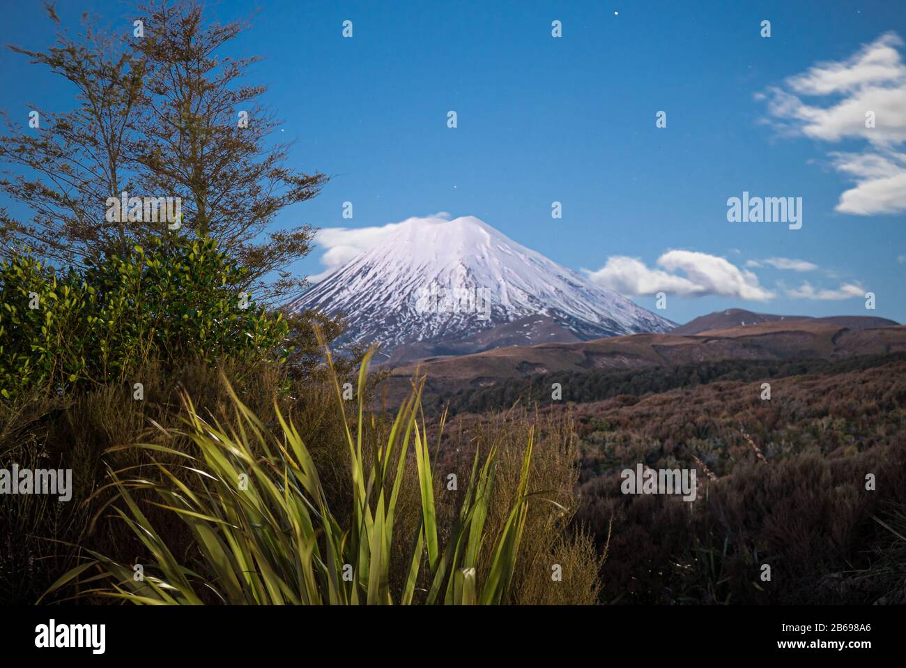 Mount Ngauruhoe in the Tongariro National Park, New Zealand taken at night illuminated by moonlight from the Skotel Alpine Resort Stock Photo