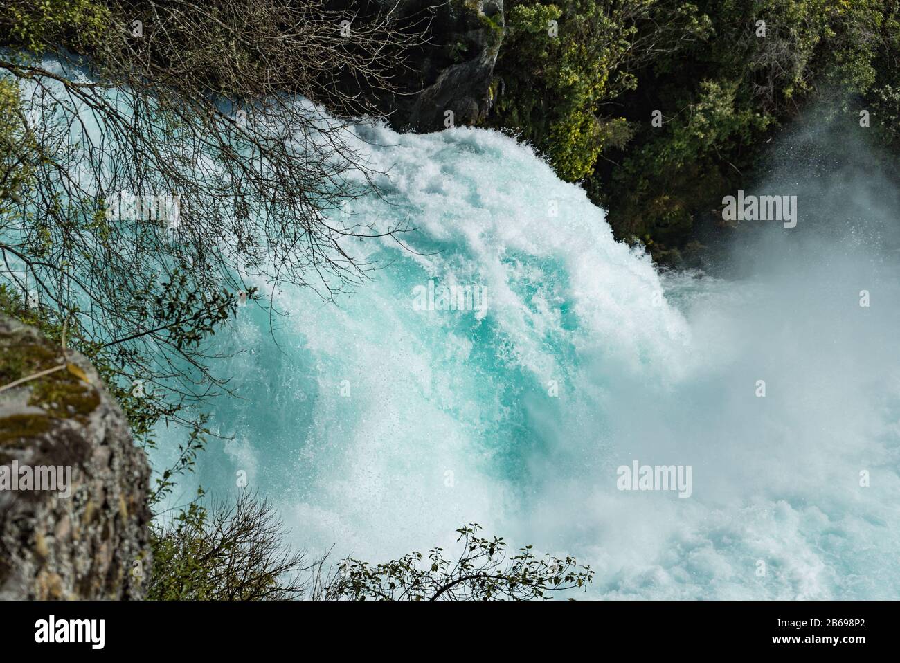 The Waikato River shows its power as it cascades over the foot of the Huka Falls near Taupo, New Zealand Stock Photo