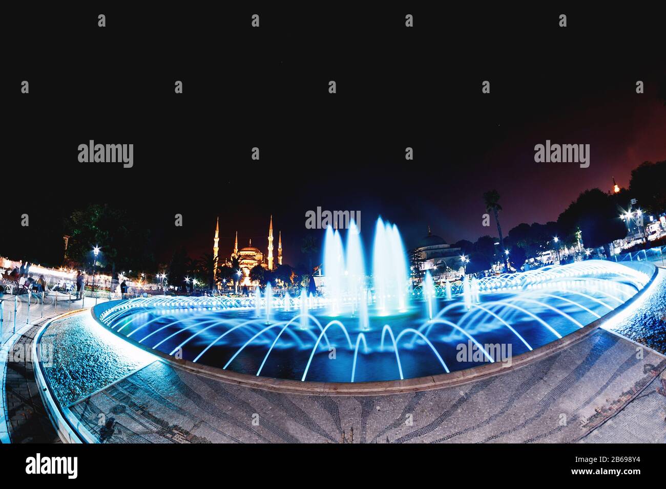 Colorful illuminated fountain on the background of the Sultanahmet Blue ...