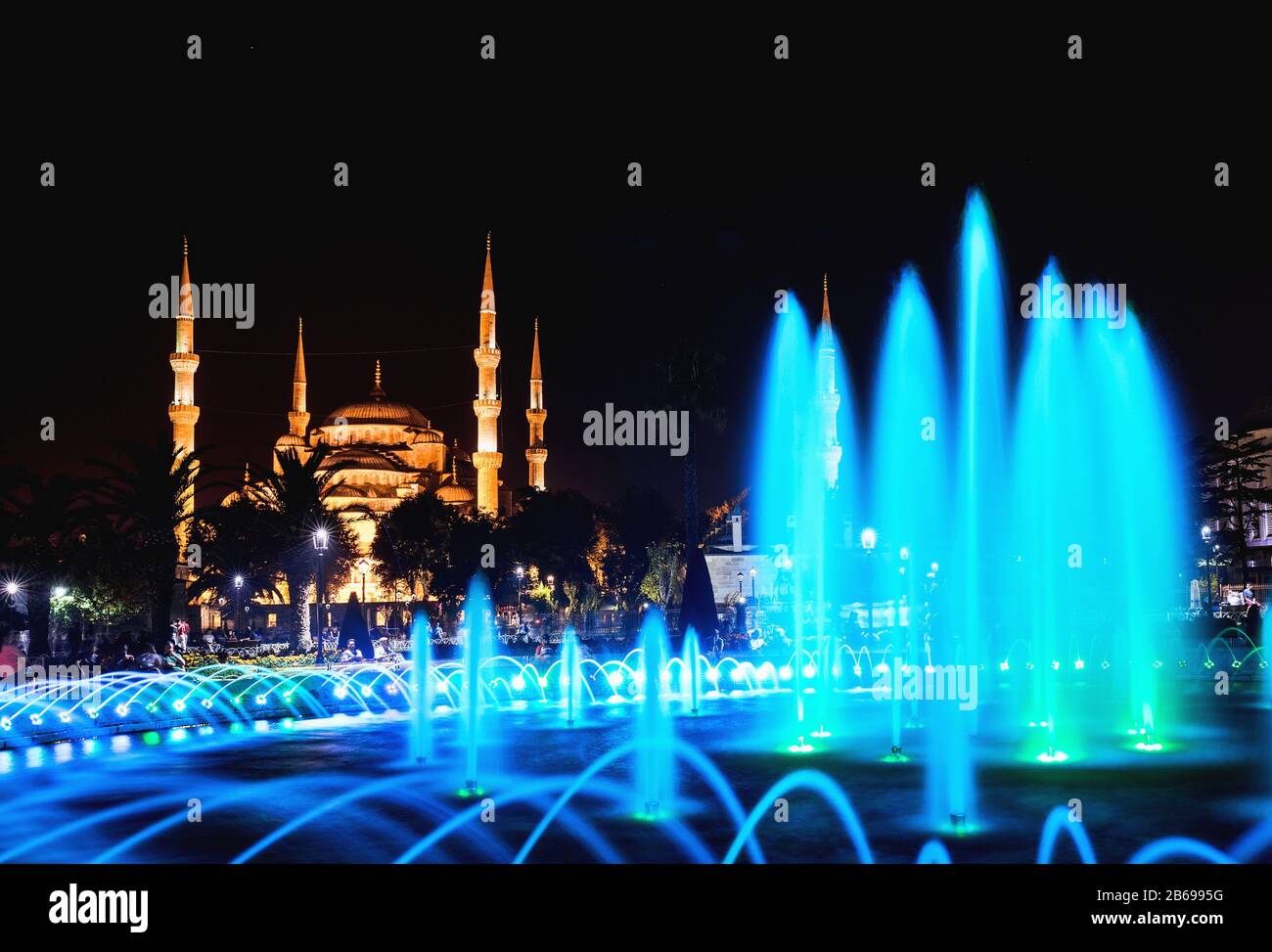 Colorful illuminated fountain on the background of the Sultanahmet Blue ...