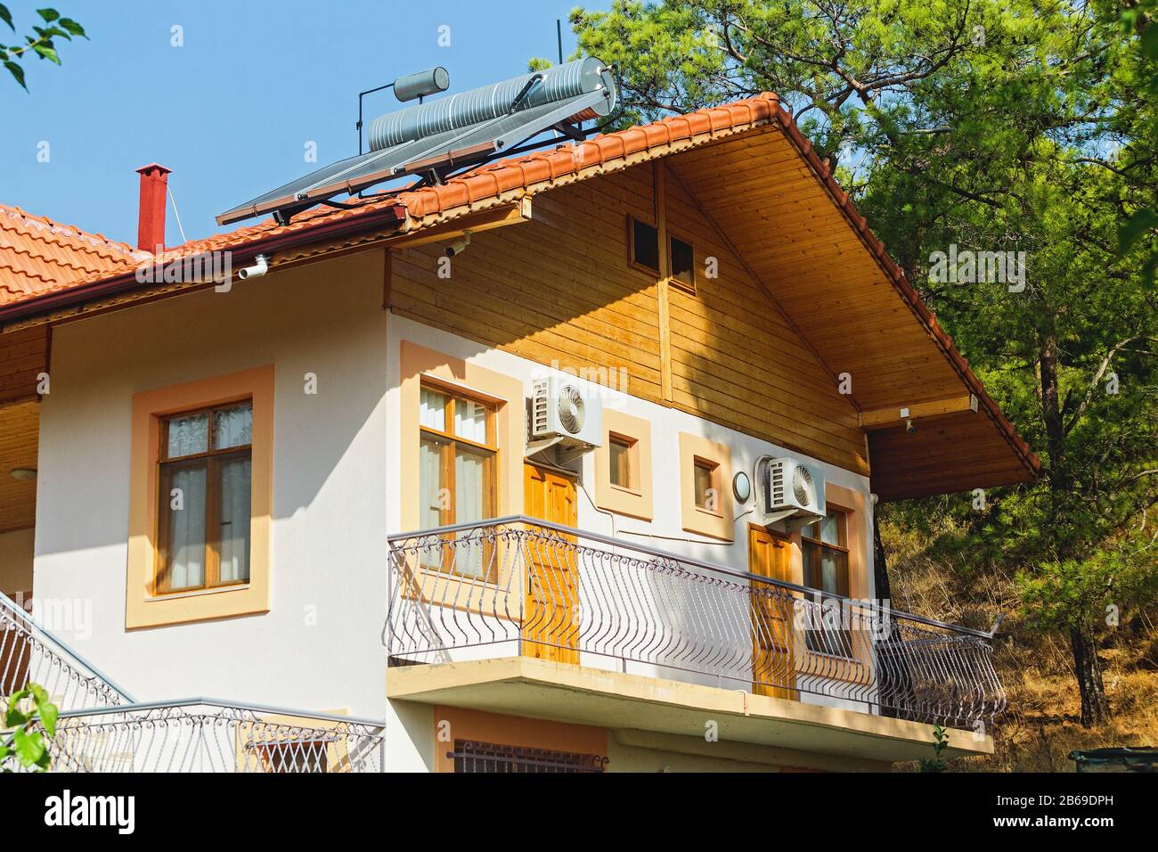 Guesthouse or tourist shelter in calm place, mountains and tropical nature in Turkey Stock Photo