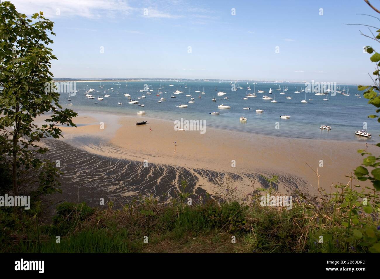 Studland Bay, low tide and anchored boats, Isle of Purbeck, Dorset