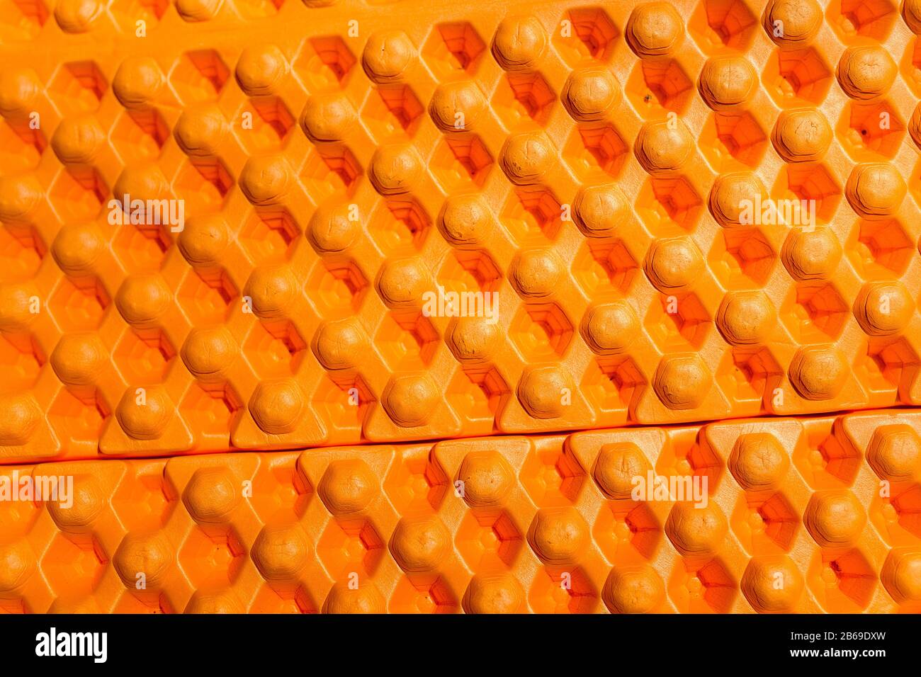 Colorful hiking mat foam closeup texture, outdoor equipment background